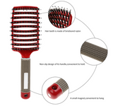 A red-vented **Hairbrush Anti Klit Brushy Haarborstel** with labeled features from **ExZachly Perfect**. The hair teeth are bristle and nylon, the handle has a non-slip design, and there's a small magnet at the bottom for convenient hanging. The brush has a perforated design for better airflow, making it perfect for scalp massage.