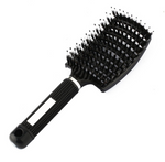 A black rectangular paddle hairbrush with a cushioned base and synthetic bristles designed for effective scalp massage. The handle has a textured grip and a small hole at the end for hanging. This Hairbrush Anti Klit Brushy Haarborstel by ExZachly Perfect is perfect for everyday use.