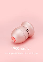 A small, cylindrical device with a pink button is positioned against a pink background. The text on the image reads "1900rpm/s" and "High grade mode of red light." Designed for personal care or grooming, it features USB charging for convenience and effectiveness in callus removal. This is the ExZachly Perfect Multifunctional Electric Foot File Grinder Machine Dead Skin Callus Remover.